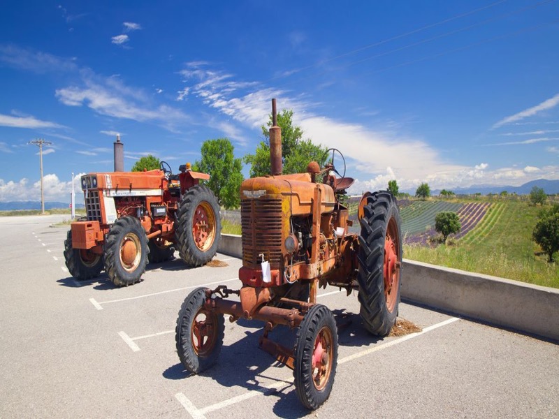 Farm equipment lined up at a rural Illinois dealership