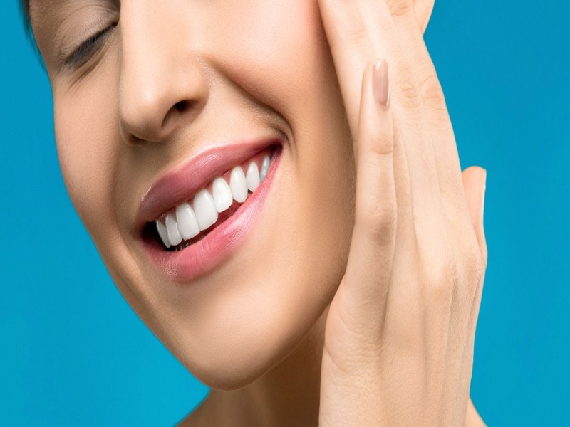 Smiling dental patient after a comfortable visit