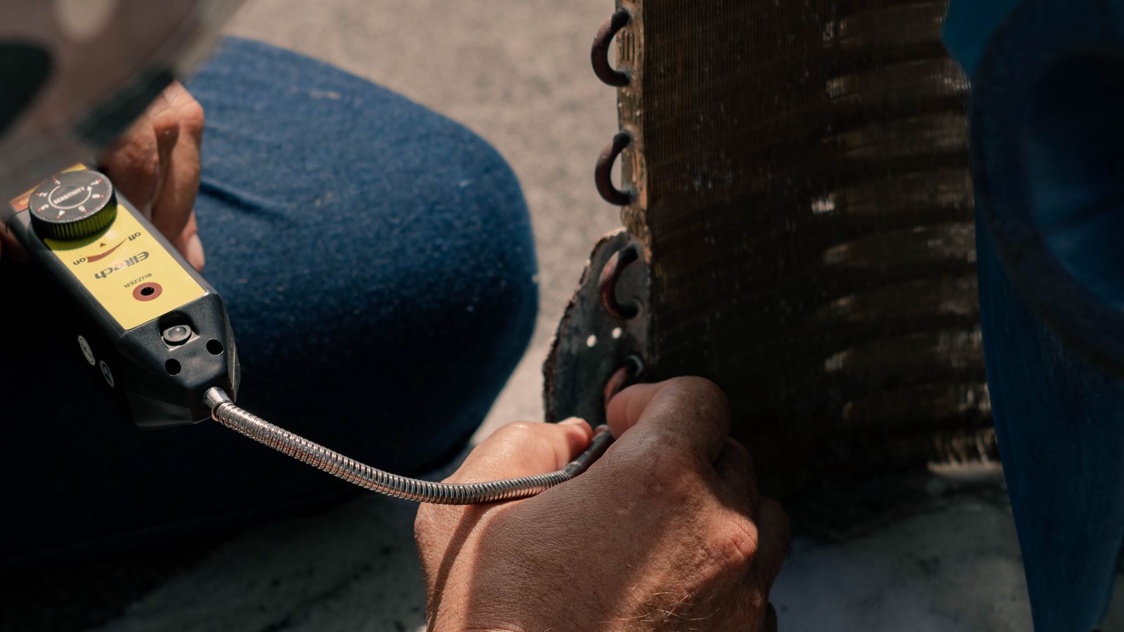 HVAC technician diagnosing heating equipment